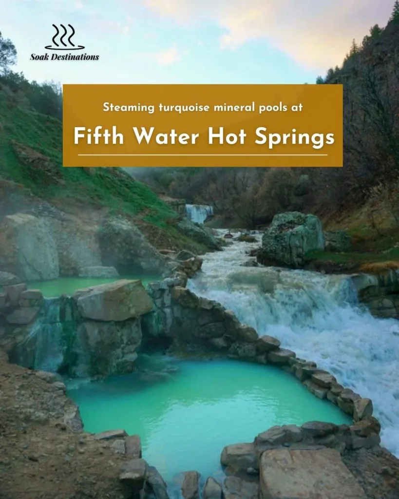 Steaming turquoise mineral pools and a rushing waterfall create a scenic vista at Fifth Water Hot Springs.