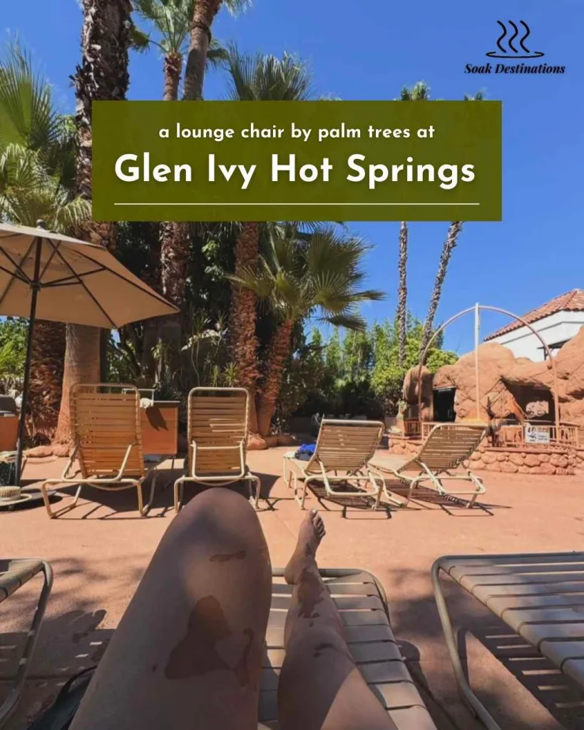 Relaxing on a lounge chair by palm trees at Glen Ivy Hot Springs under clear skies.