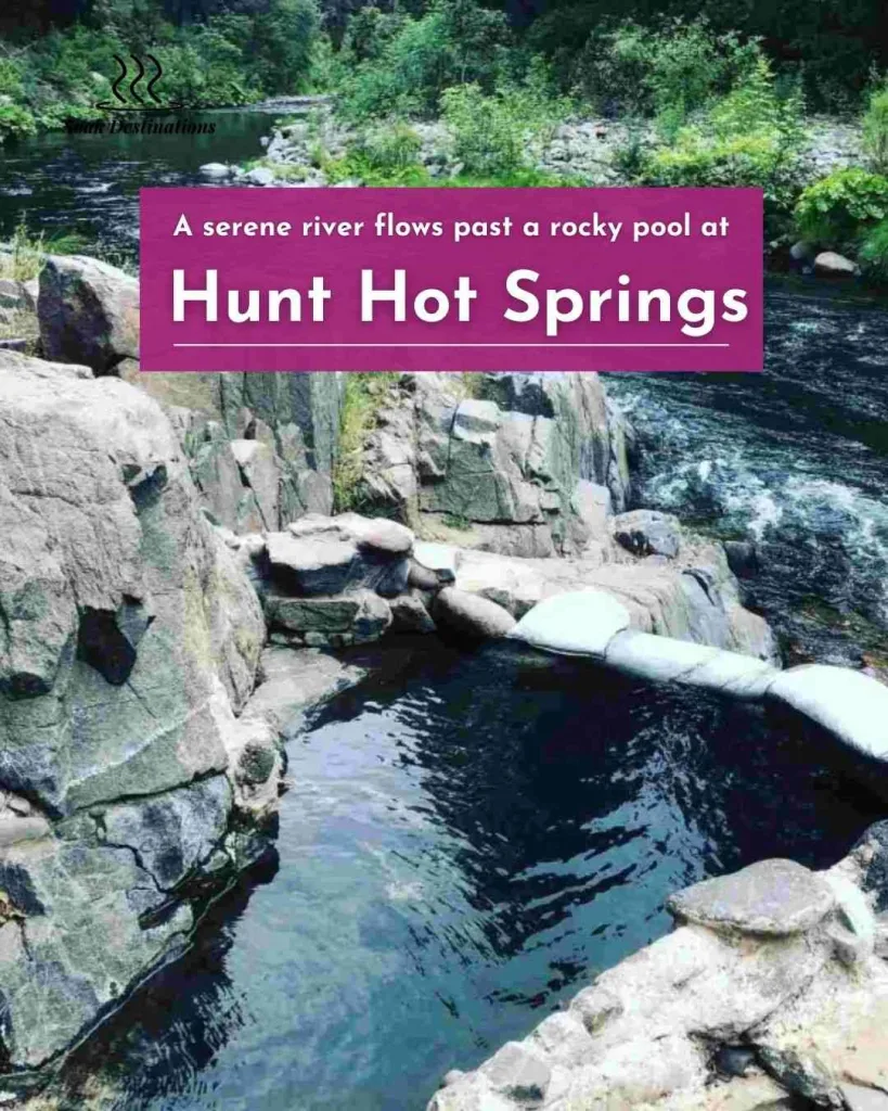 A serene river flows past a rocky pool at Hunt Hot Springs nestled in lush greenery.