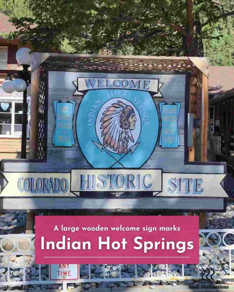 A large wooden welcome sign marks the Colorado historic site of the famous Indian Hot Springs.