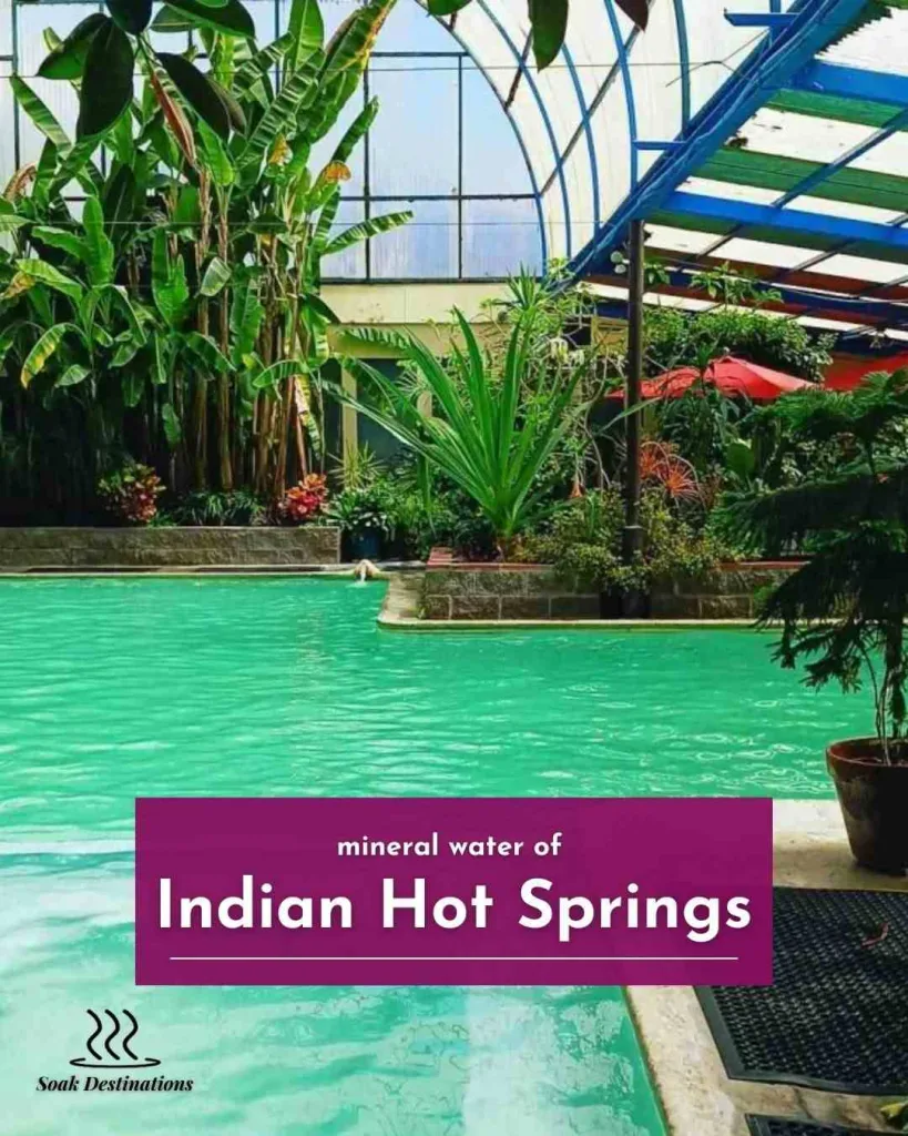 A large wooden welcome sign featuring a Native American chief greets visitors at Indian Hot Springs.