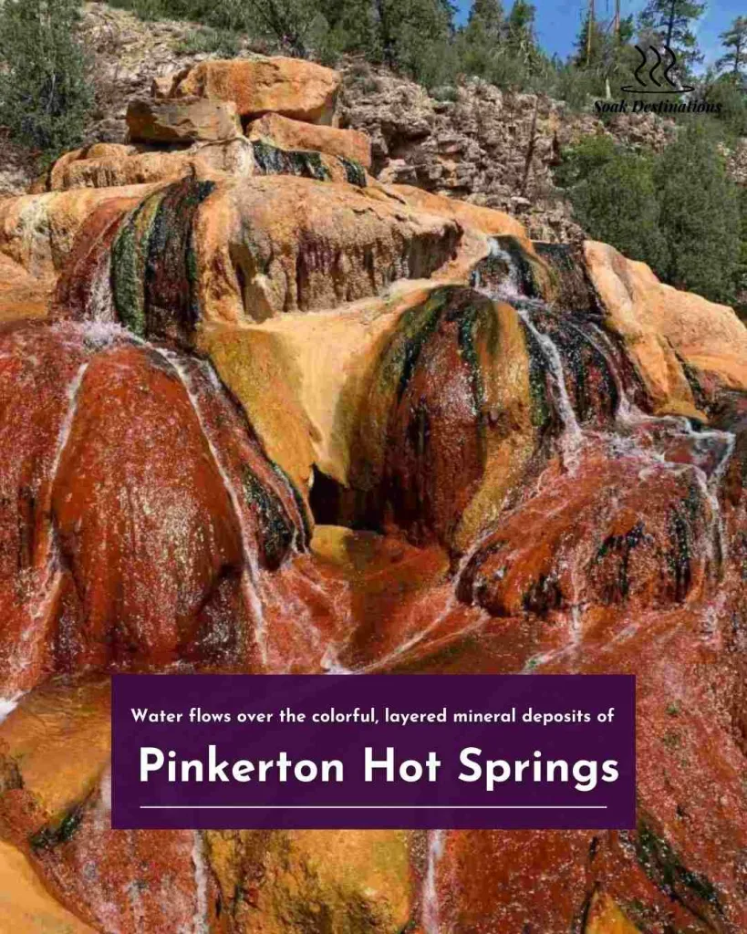 Water flows over the colorful, layered mineral deposits of Pinkerton Hot Springs in the Colorado mountains.