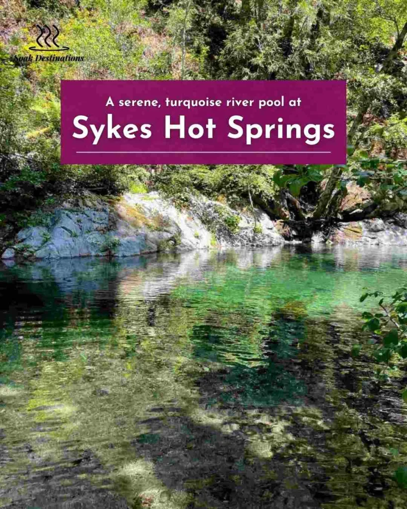 A serene, turquoise river pool surrounded by lush green trees on the way to Indian Hot Springs.