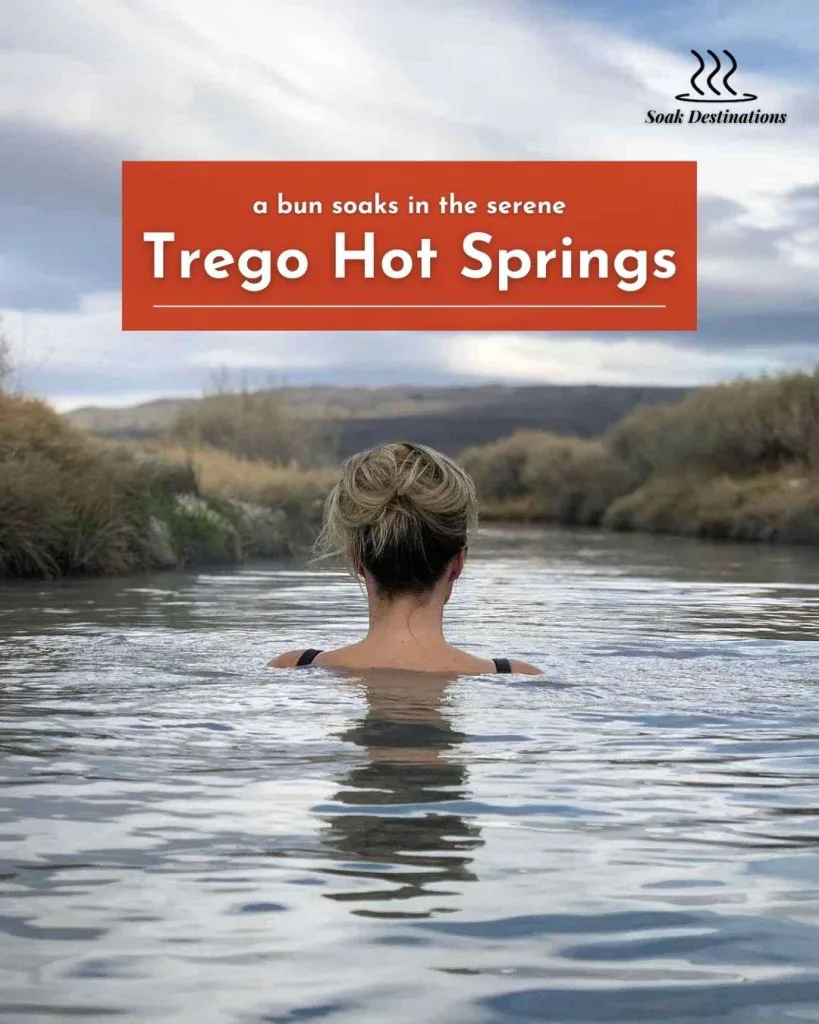 A woman with blonde hair in a bun soaks in the serene Trego Hot Springs.
