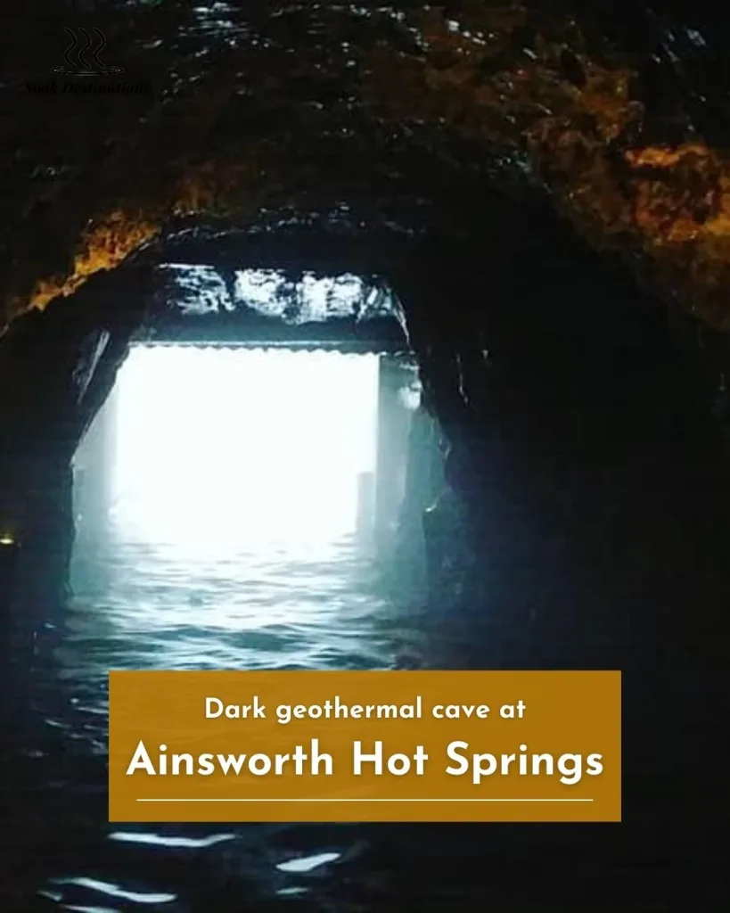 Ainsworth Hot Springs 7 - soakdestinations Dark geothermal cave at Ainsworth Hot Springs, glowing faintly with steam and natural mineral water.