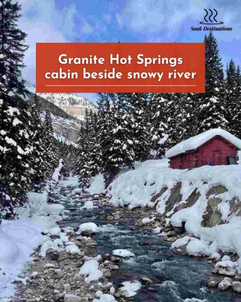 Granite Hot Springs 10 - soakdestinations Granite Hot Springs cabin beside snowy river and pine forest