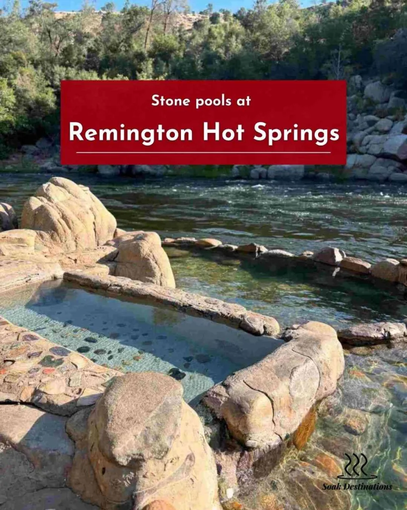 Stone pools at Remington Hot Springs sit along the flowing Kern River beneath a forested hillside.