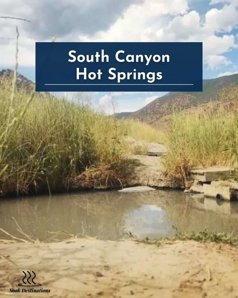 South Canyon Hot Springs pool surrounded by tall grassy hills