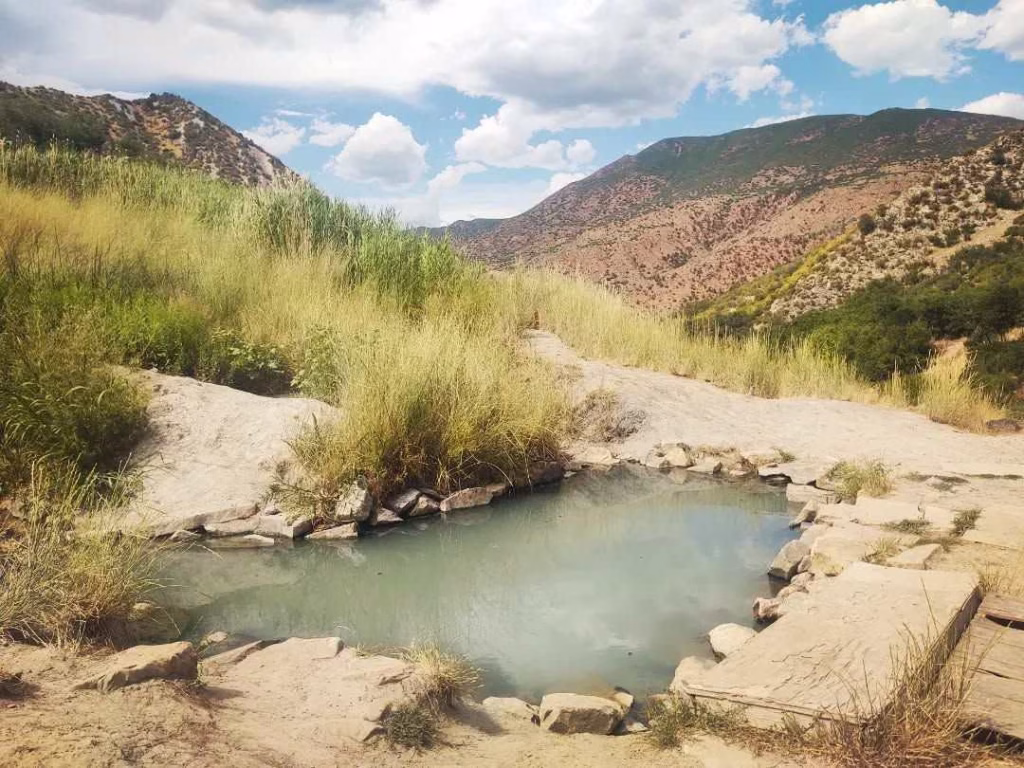 South Canyon Hot Springs natural pool in mountain valley landscape