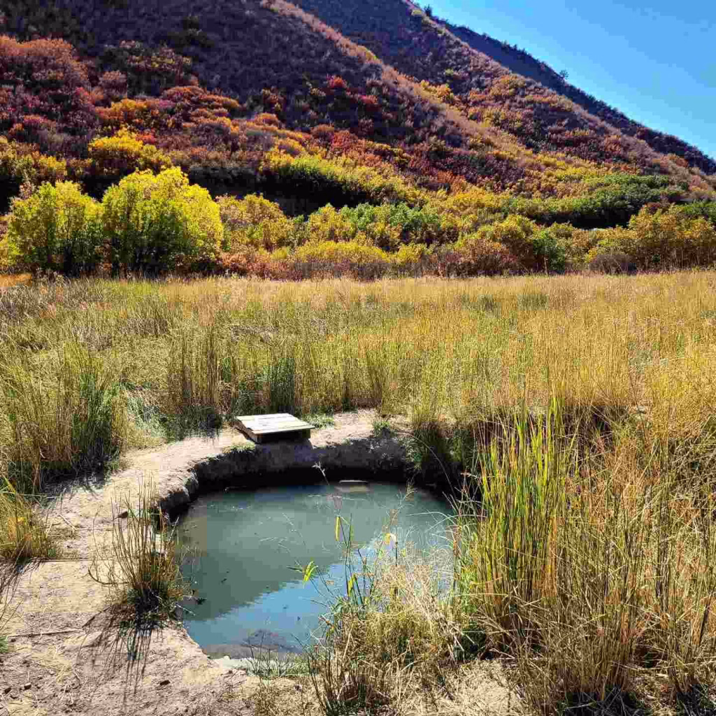 South Canyon Hot Springs natural pool in scenic autumn valley.