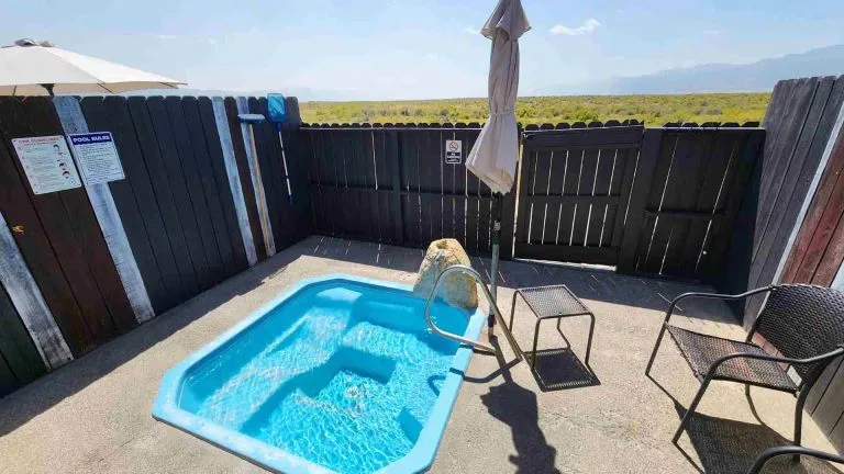 Surprise Valley Hot Springs 1 1 - soakdestinations Private outdoor soaking tub with scenic view at Surprise Valley Hot Springs.