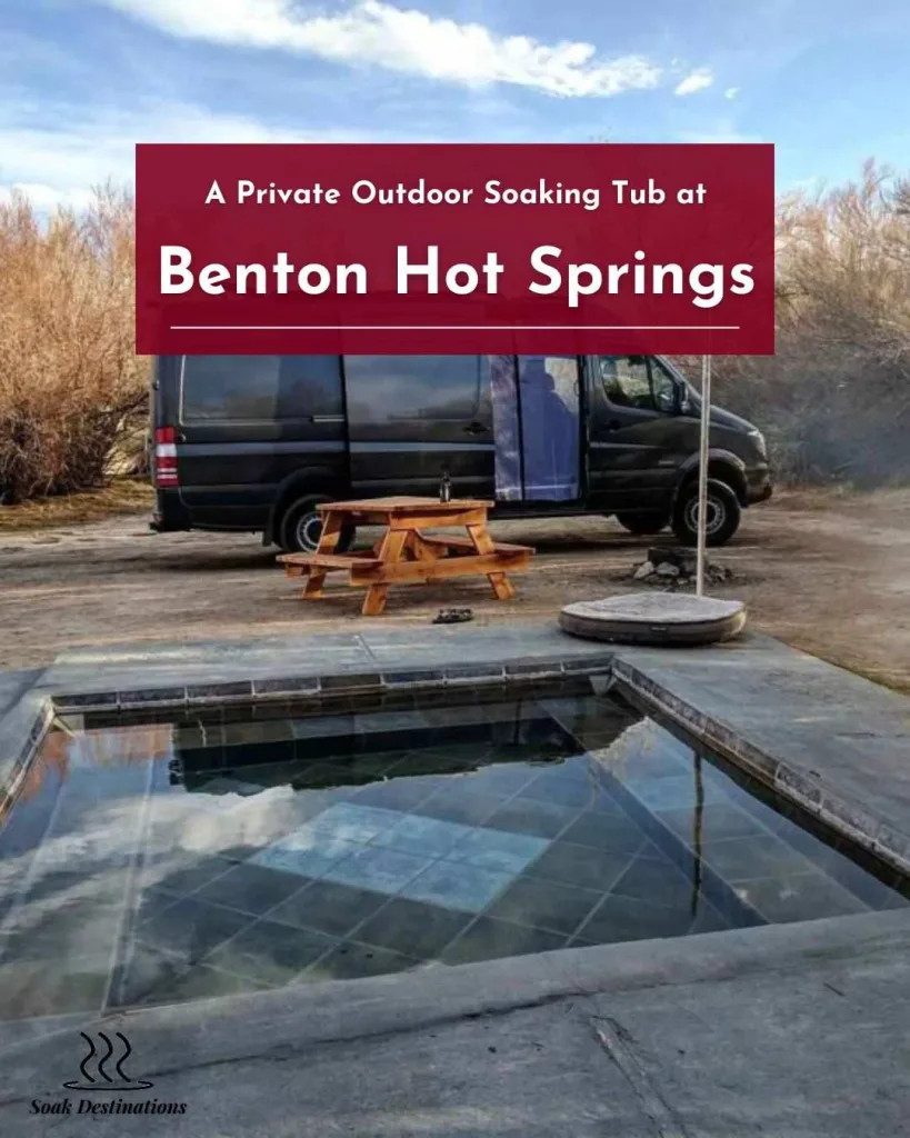 A camper van parked next to a private outdoor soaking tub at Benton Hot Springs.