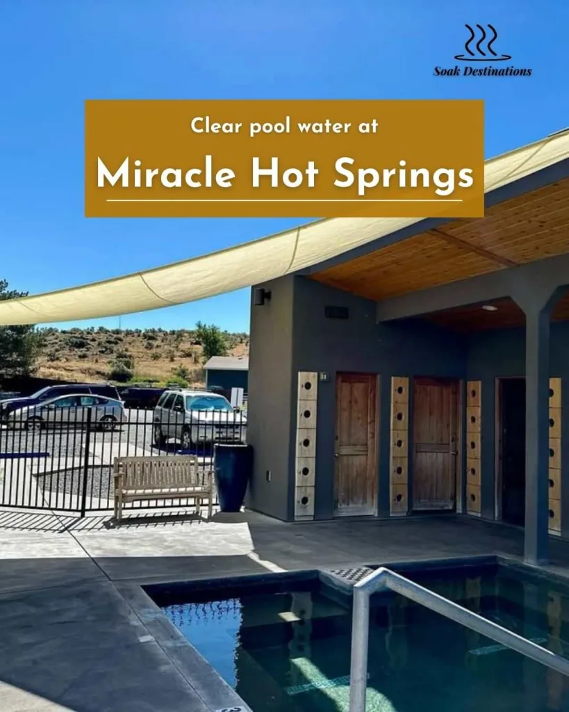 Clear pool water at Miracle Hot Springs, with a shade canopy protecting the relaxing area.